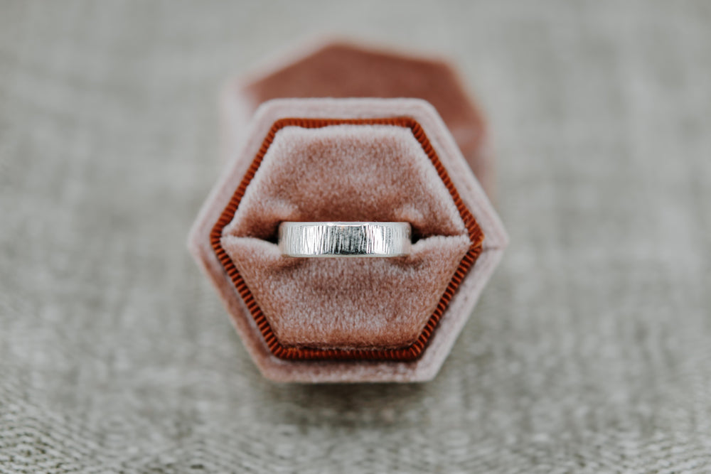 Bevelled ring in white gold by Stockholm Rose Designs. Ethical wedding ring handmade in Stockholm, Sweden.